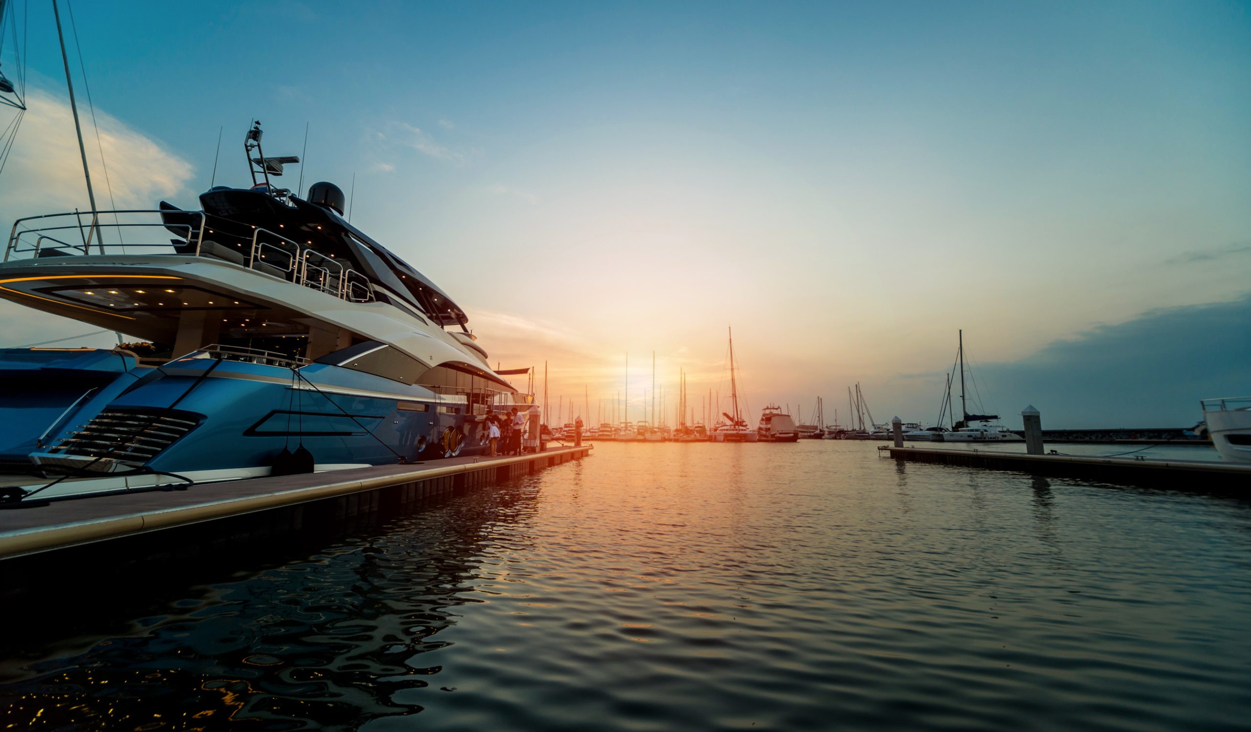 Beautiful view of marina and harbor with yachts and motorboats.